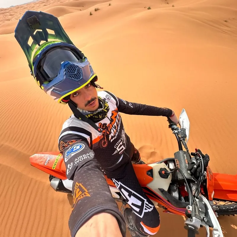 Enduro motorcycle rider in the Merzouga dunes